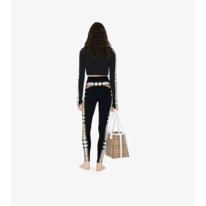 Krátký top na zip z elastického džerzeje s kostkovaným lemem Krátký top na zip z elastického džerzeje s kostkovaným lemem