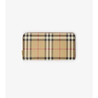 Péřová bunda s pruhem s kostkovaným vzorem Burberry na předním zipu a skládací kapucí v naší charakterist