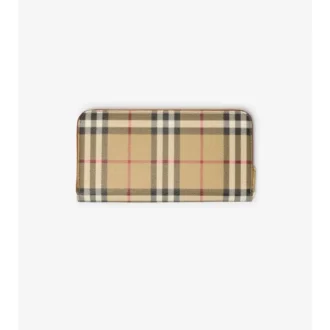 Péřová bunda s pruhem s kostkovaným vzorem Burberry na předním zipu a skládací kapucí v naší charakterist